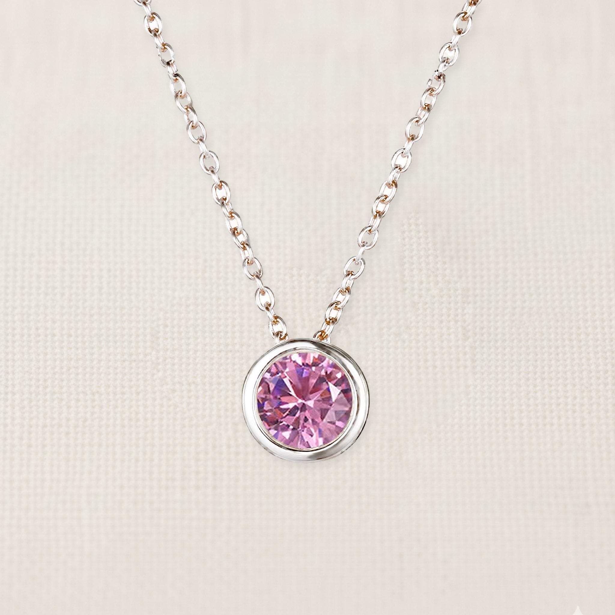 Bezelle Aurora Pendant necklace with pink sapphire birthstone in sterling silver