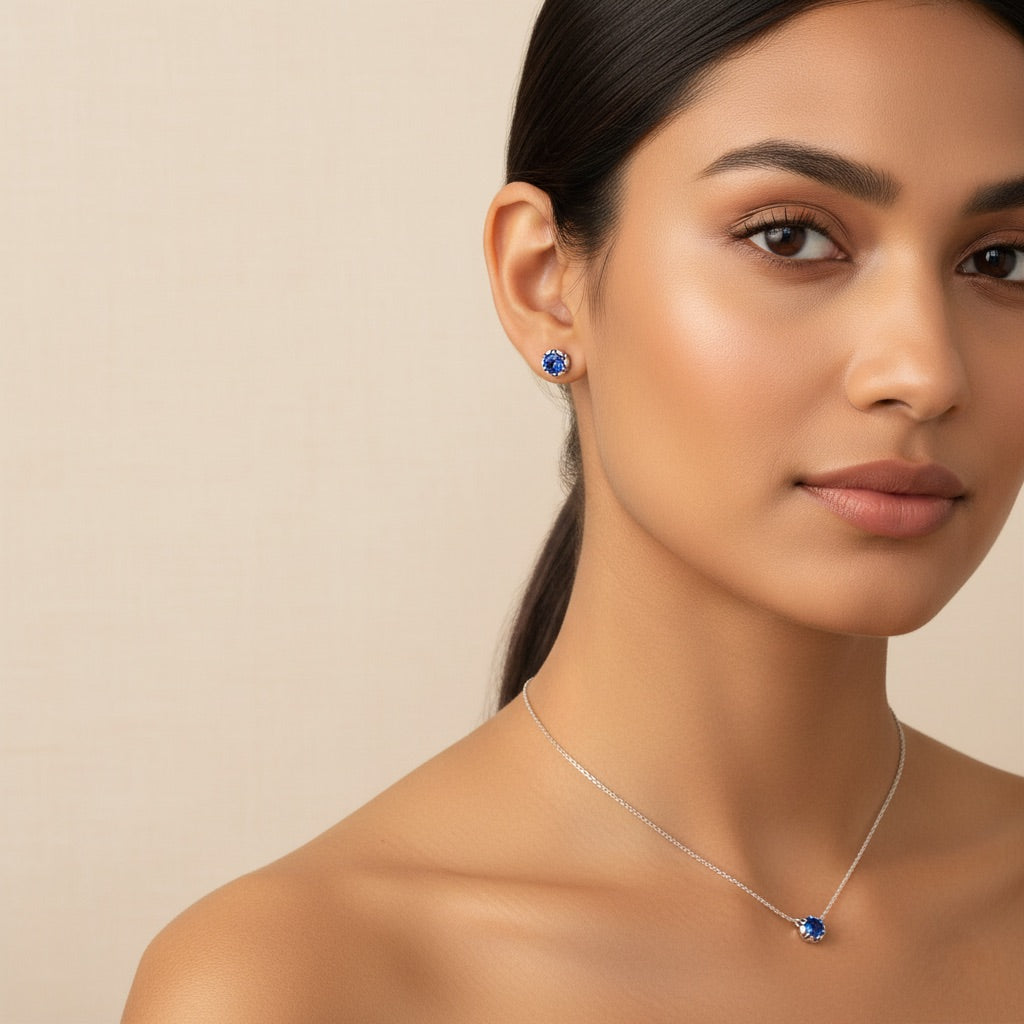 Bezelle hero banner showcasing Aurora Pendant birthstone necklace and Lustre Studs sapphire earrings