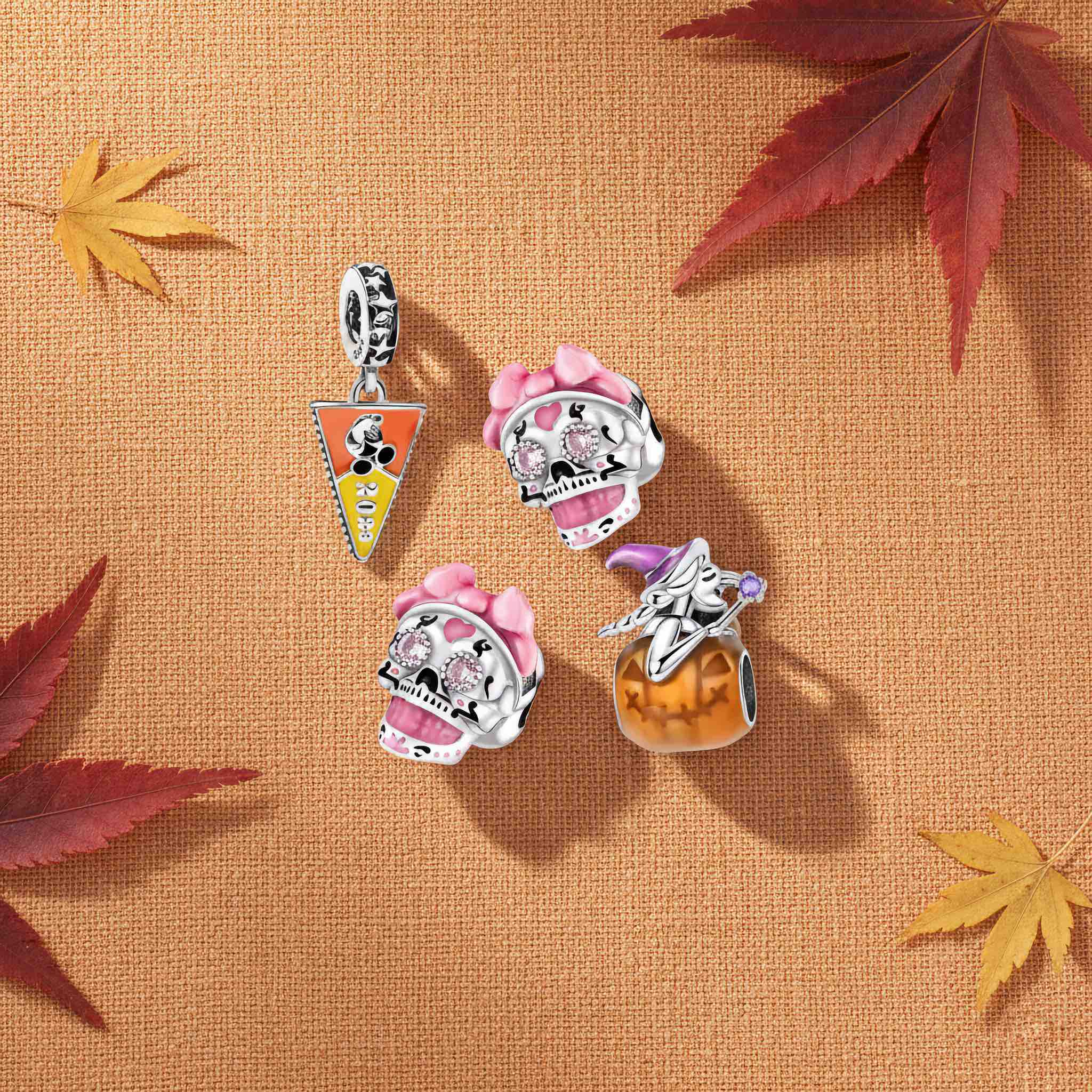 Bezelle Jewelry seasonal fall banner with sterling silver pumpkin pie charm, ghost charm, and Halloween lantern charm.