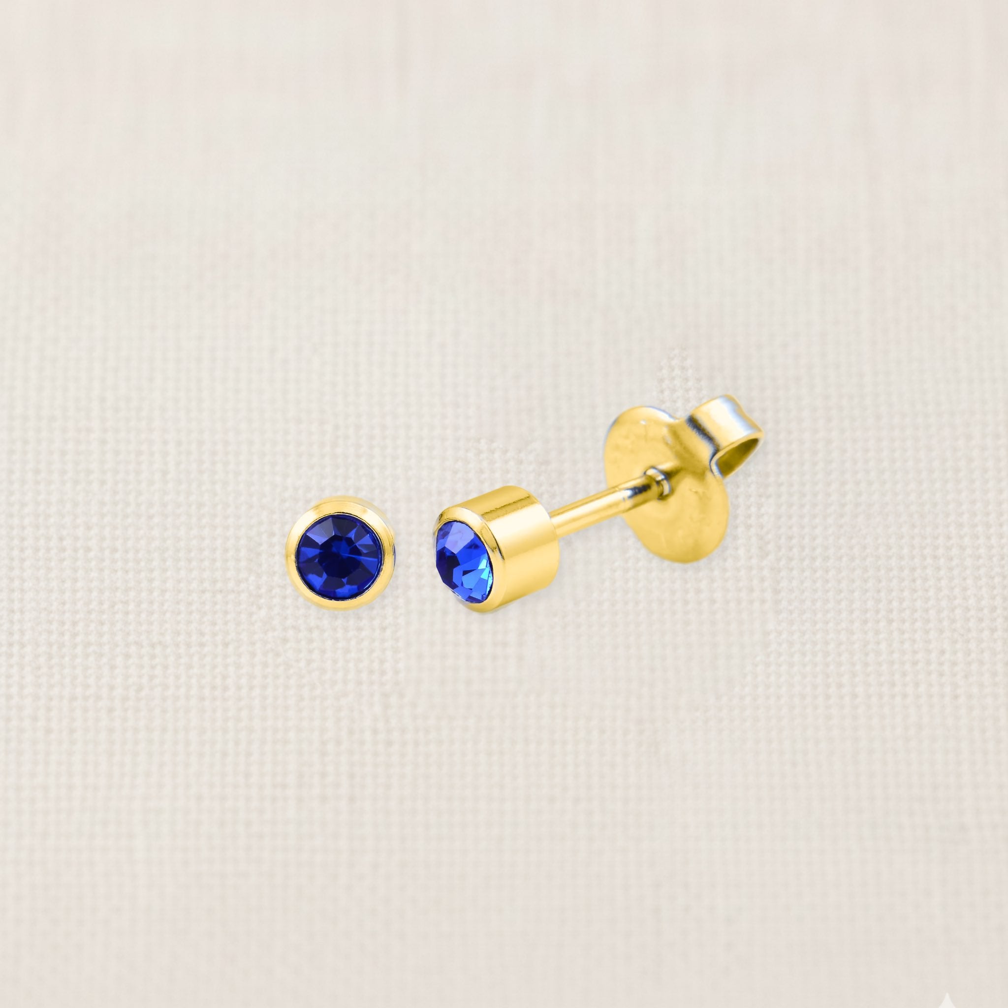 Bezelle Lustre Studs with lab-created sapphire in 14K yellow gold, 5mm birthstone earrings